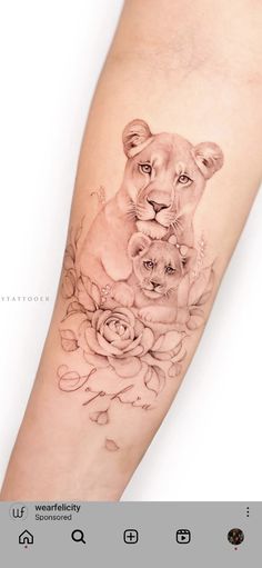 a woman's arm with a lion and roses tattoo on it