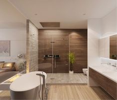 a modern bathroom with wood flooring and white bathtub next to a large window