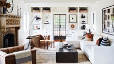 a living room filled with furniture and a fire place