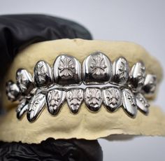 #ChromeHearts #Grillz #LuxuryFashion #DesignerJewelry #HighFashion #ChromeHeartsGrillz #FashionAccessories #StatementJewelry #Bling #FashionTrends Chrome Hearts Grills, Fire Accessories, Silver Grillz, Teeth Jewelry, Clothing Mockup, Chrome Hearts, Cute Jewelry, Statement Jewelry, Dream Life