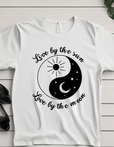 a t - shirt that says live by the sun love by the moon