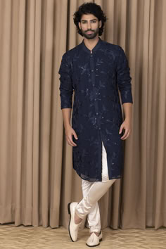 Navy blue kurta in cotton silk and georgette base with thread machine embroidery. It is paired with contrasting churidar pants.  #Perniaspopupshop #menswear #ethnic #whatiworewastrending #ppuslove #kurtaset #georgette #threadwork #cottonsilk #weddingwear #festivewear #traditional #embroideredkurta Asian Long Hair, Wedding Outfits For Groom, Gents Kurta Design, Gents Kurta, Kurta Set For Men, Ethnic Outfits