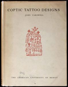 an old book with red ink on it's cover and the words copric tattoo designs