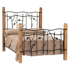 a metal bed frame with branches and leaves on the headboard is shown in this image