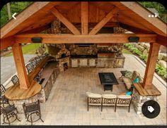 an outdoor kitchen and dining area is shown