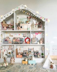 a doll house with lots of furniture and accessories