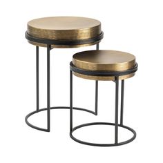 two round tables with metal bases and gold colored tops, one sitting on top of the other