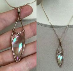 a woman wearing a necklace with an opal stone in the shape of a leaf