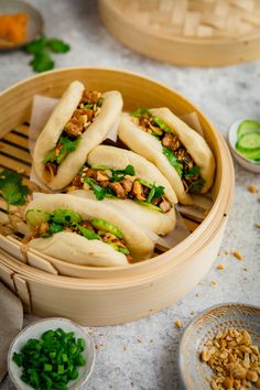 some food is in a wooden bowl on the table