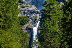 a waterfall in the middle of some trees