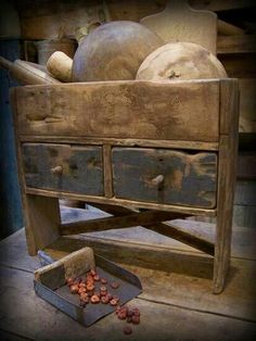 an old wooden dresser with some items on it's top and one drawer open