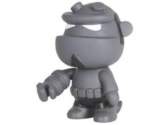 a gray toy figurine is shown on a white background