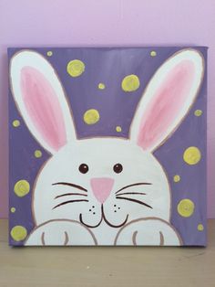 a painting of a white rabbit with pink ears and yellow dots on it's chest