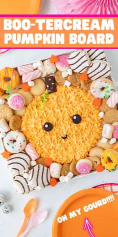 an orange plate topped with lots of different types of cookies and sprinkles