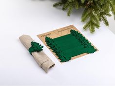 a christmas tree decoration next to a napkin