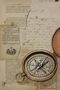 an old map with a compass on it and some writing paper in the back ground