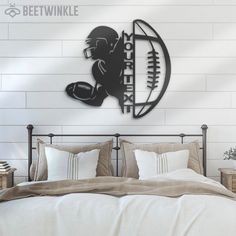 a bedroom with a bed and a wall mounted football player