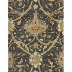 an area rug with various designs and colors on it, including brown, beige, orange and