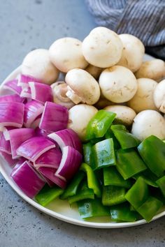 onions, green peppers and garlic on a plate