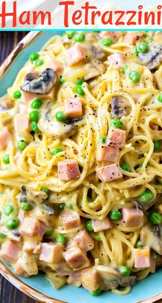 ham tetrazzini pasta with peas and mushrooms on a blue plate