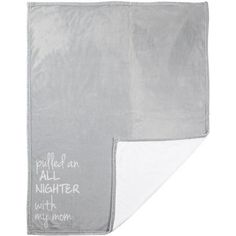 a gray blanket with white writing on it