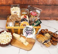 a basket filled with lots of food sitting on top of a counter next to other items