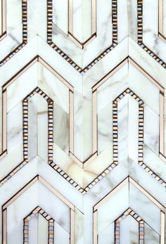 an abstract marble pattern with gold and silver lines in the center, on top of a white background