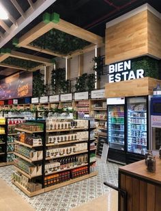 a grocery store filled with lots of food and drink bottles in it's shelves