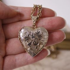 Vintage heart photo locket necklace Signed 1928 Gold tone floral memory locket Long chain necklace Dimensions Chain - 71 cm / 27.95 inches The chain is not adjustable Locket - 3.1 * 4.2cm / 1.22 * 1.65 inches Signed - 1928 Condition - This item is vintage, not new and may show some signs of wear or use. Please ask questions if you have any doubt of an items condition. ! Please make sure to review an item listing description carefully, examine photos, and read my 'Shipping Policies' before making Lockets Necklace, Vintage Locket Necklace, Locket Vintage, Locket Necklace Vintage, Vintage Locket, Heart Photo, Photo Locket Necklace, Memory Locket, Vintage Lockets