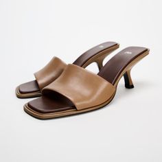 Heeled Leather Mules. Wide Front Strap. Contrasting Color Insole And Asymmetric Heel. Squared Toe. Heel Height: 2.4 Inches (6 Cm) Brand Zara Color Brown | 1303/410 Composition Upper 100% Sheep Leather Lining 100% Polyester Sole 100% Polyurethane Thermoplastic Insole 100% Polyurethane Condition New With Tag New In 2024 Zara Mules, Zara Sandals, Rope Sandals, Zara Heels, Square Toe Sandals, Genuine Leather Sandals, Woven Sandals, Black Leather Flats, Zara Leather