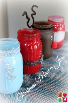 three mason jars decorated to look like christmas decorations