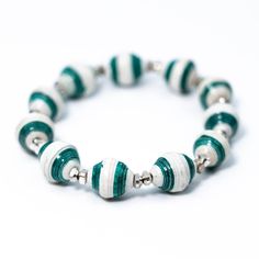 a green and white bracelet with silver beads