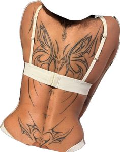 the back of a woman with tattoos on her body