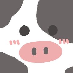 a black and white cow's face with pink spots on its nose is shown