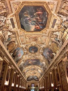 an ornate ceiling with many paintings on it