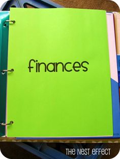 a green binder with the word finance written on it