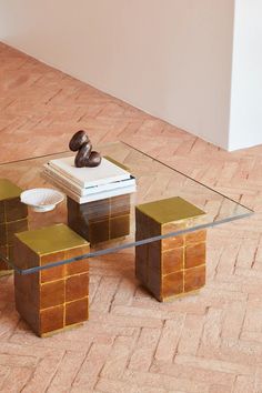 a glass table with some books on it