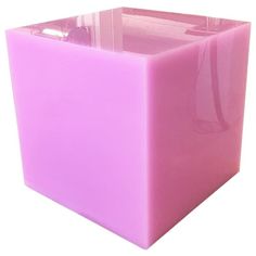 a pink cube shaped object on a white background