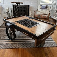 a coffee table with wheels on it in a living room