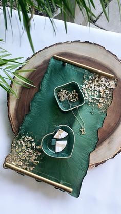 a green tray sitting on top of a tree stump