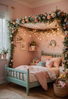 a bedroom decorated in pink and green with flowers on the bed, lights strung over the headboard