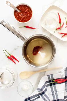 the ingredients for chili sauce are shown in bowls