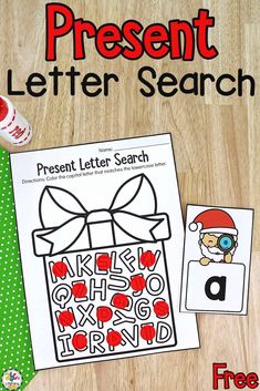 a present letter search is shown on a wooden table with christmas themed items and a green polka dot tie