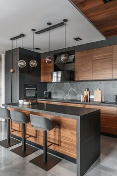 a modern kitchen with marble counter tops and wooden cabinets, along with bar stools