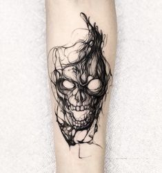 a black and white photo of a skull on the leg