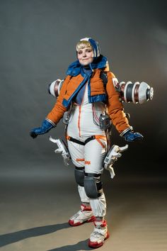 a man in an orange and blue space suit