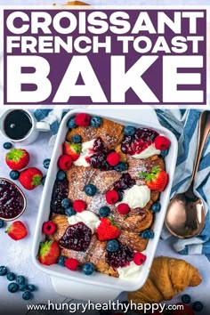 a close up of a plate of french toast with berries and blueberries on it