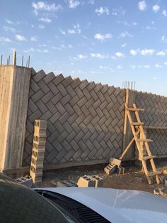 a building being constructed with bricks and scaffoldings on the side of it