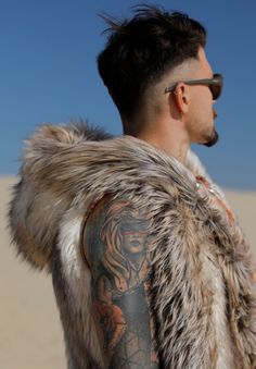 "In the heart of the desert, the wolf roams free." Introducing the Desert Wolf Vest – a wild fusion of untamed nature and vibrant desert hues. This vest is more than just a garment; it's a statement of freedom, strength, and raw beauty. Whether you're exploring the dunes of Burning Man or making a bold entrance at a winter festival, the Desert Wolf Vest will keep you warm and stylish, embodying the spirit of the wild. The Desert Wolf Vest is a masterpiece of design and craftsmanship. The luxurio Mens Faux Fur Vest, Desert Wolf, Jungle Outfit, Reversible Coat, Winter Festival, Wild Spirit, Raw Beauty, Faux Fur Vest, The Dunes