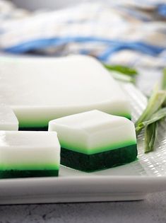 three pieces of green and white soap on a plate